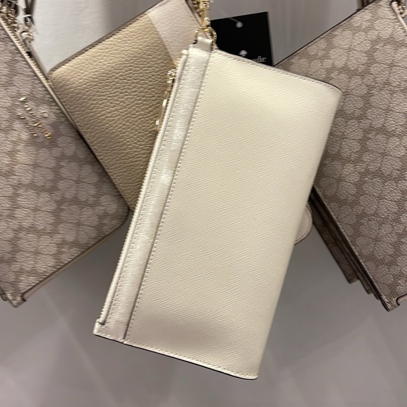 Kate Spade Madison Double Zip Wristlet Wallet Phone Case 
Meringue
NWT - Picture 10 of 16